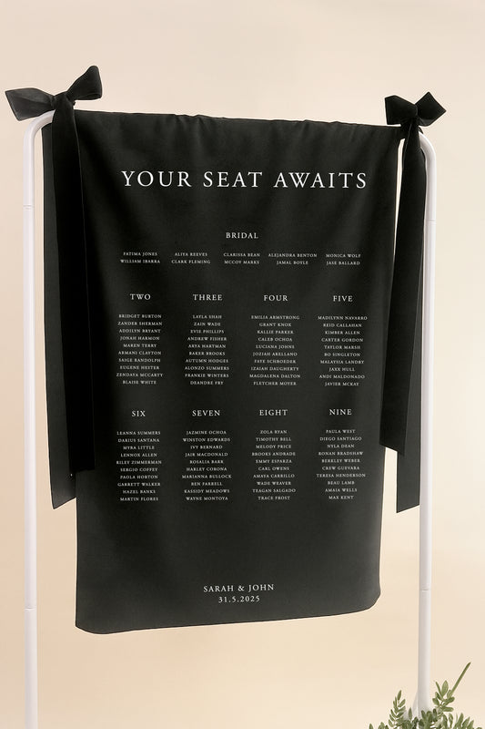 Black seating chart with 'Your Seat Awaits' text on a beige background