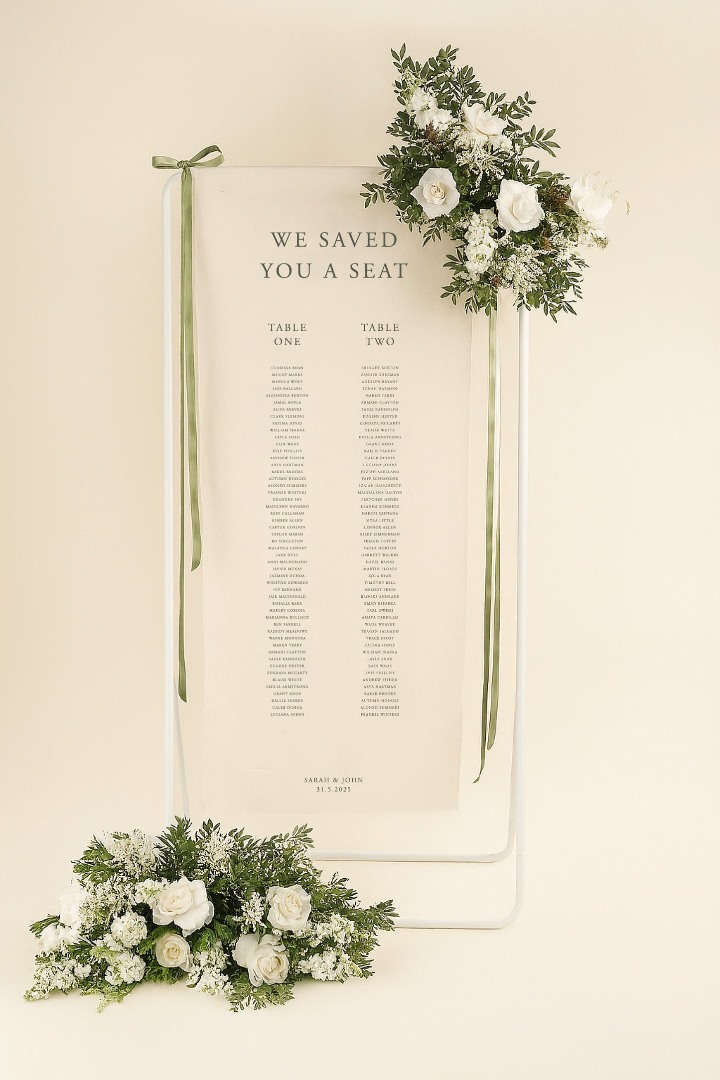 Wedding seating chart with floral decorations on a beige background