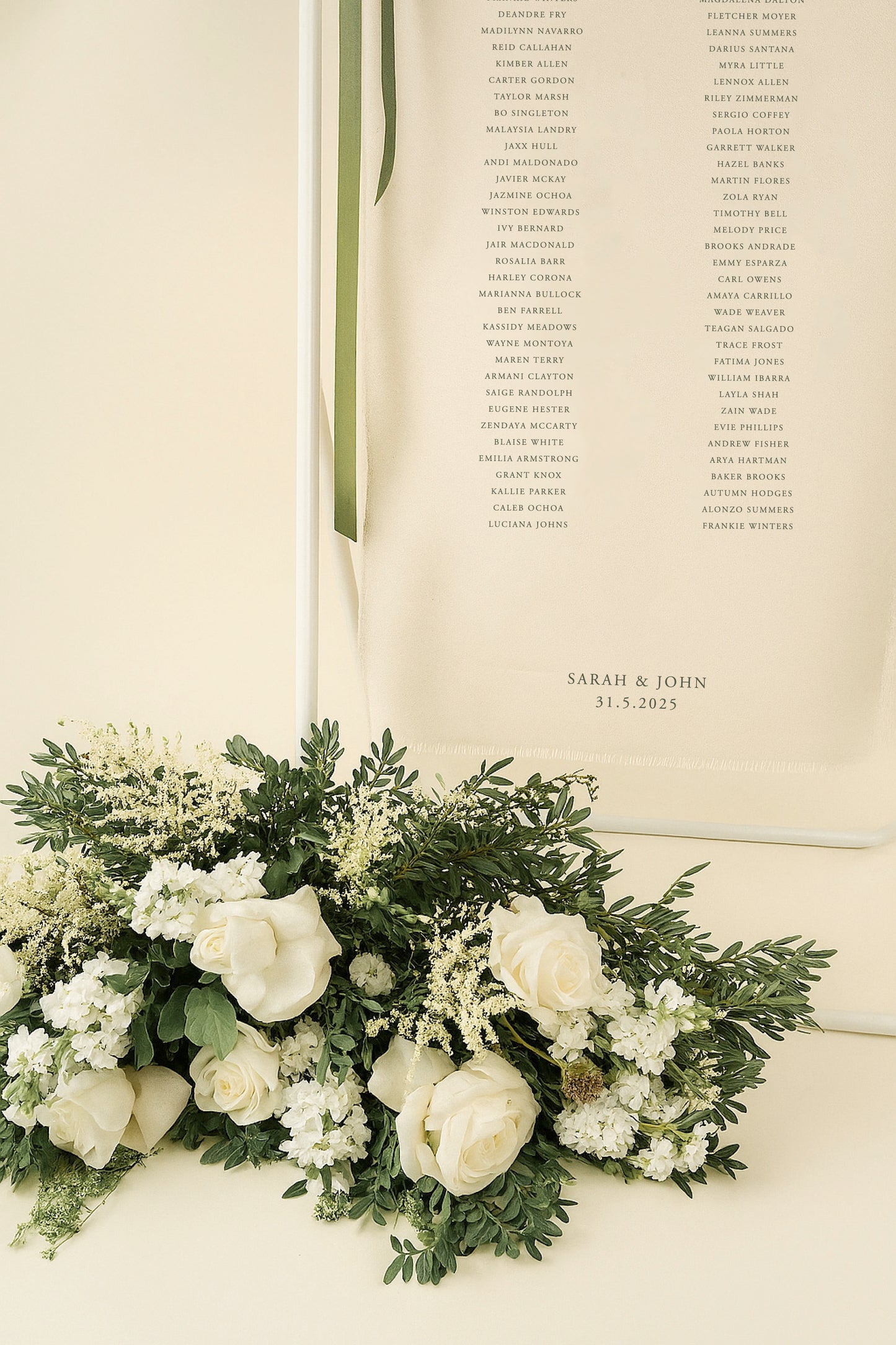 Floral arrangement with a wedding program on a light background