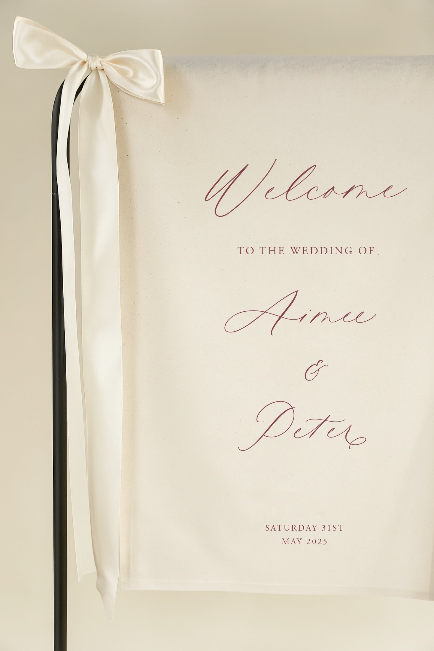 Wedding welcome sign with a ribbon on a beige background