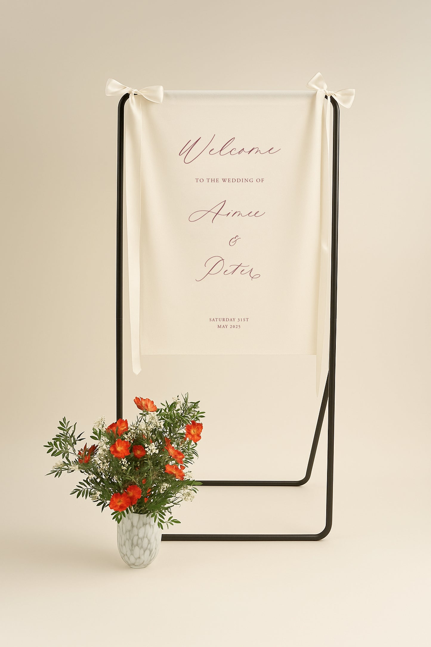 Wedding welcome sign with floral arrangement on a beige background