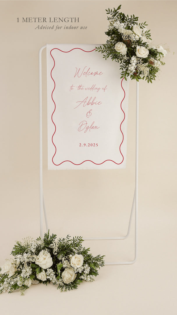Wedding welcome sign with floral decorations on a beige background