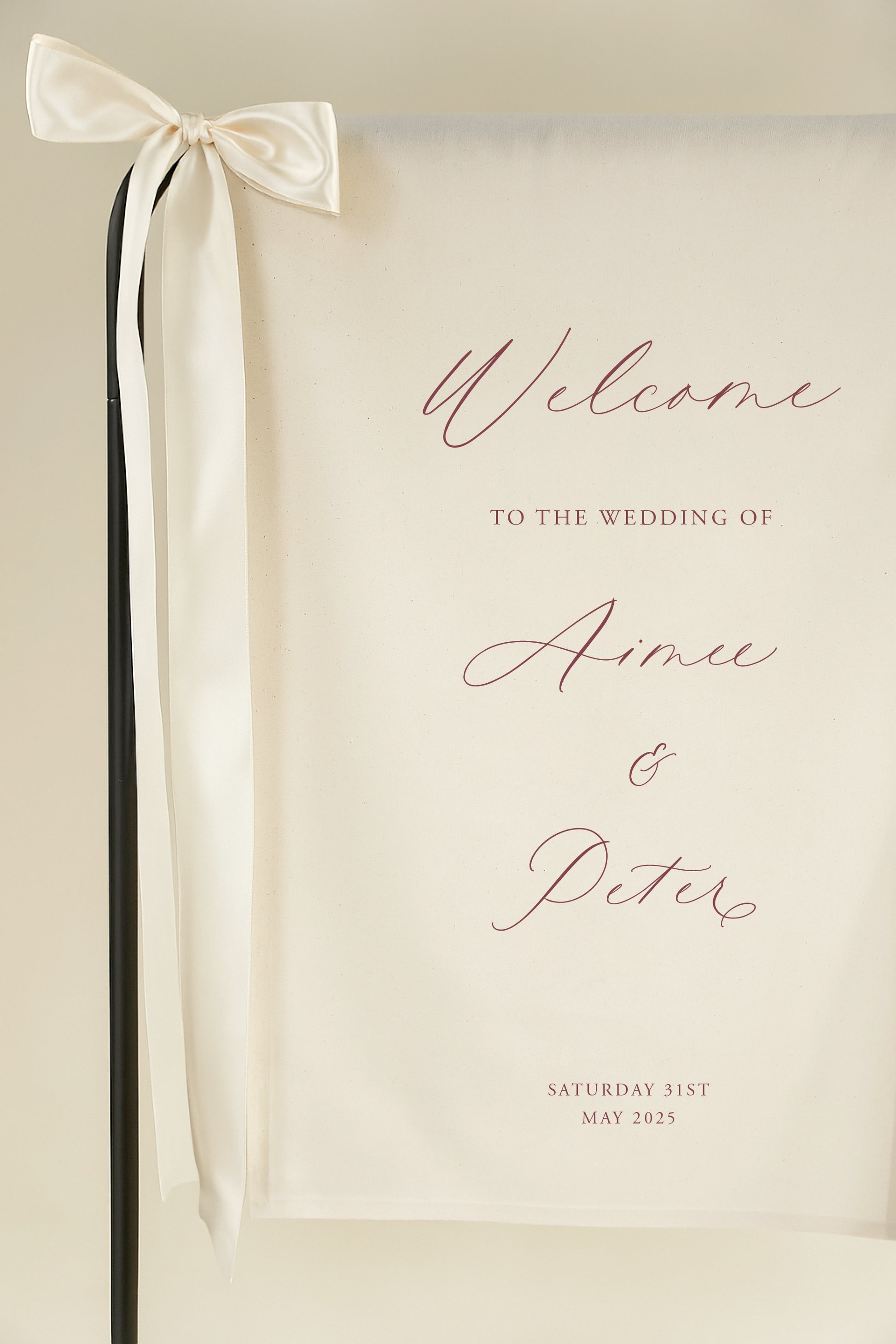 Wedding welcome sign with a ribbon on a beige background