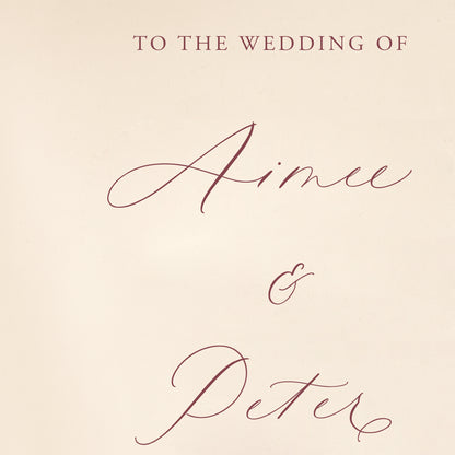 Invitation welcome sign with 'To the wedding of Aimee & Peter' text on a beige background
